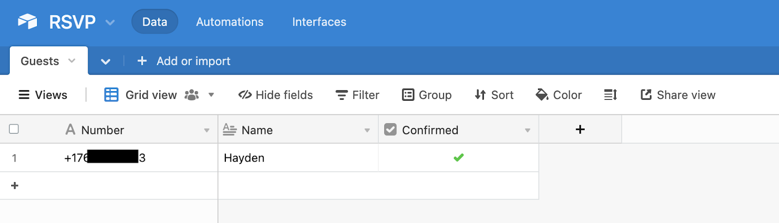 RSVP Airtable showing a green checkmark under Confirmed column for the record with personal phone number