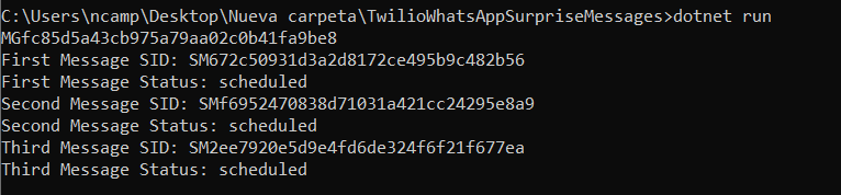 Command line output of sending the messages to Twilio printing their status and Id.