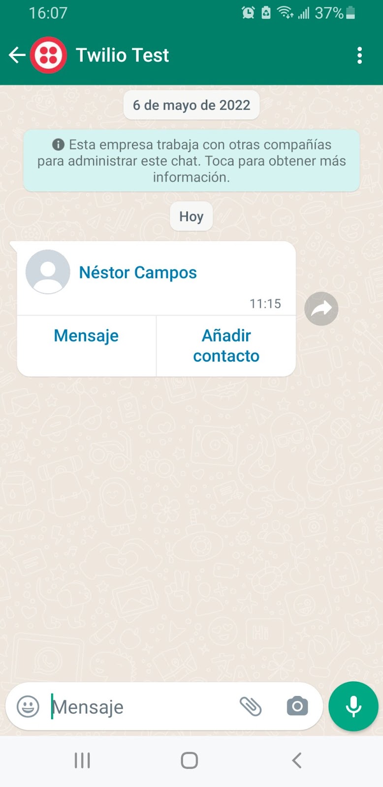 WhatsApp message received with the Twilio Sandbox number. The Sandbox sent a message with the contact information using a vCard format.