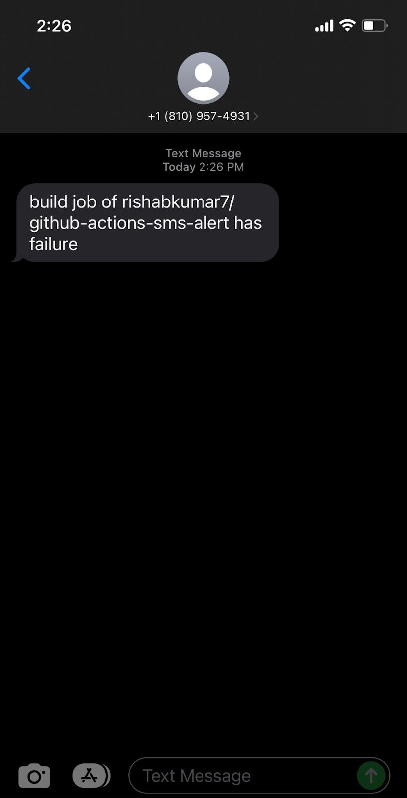 Picture of an SMS triggered by a failing GitHub Action