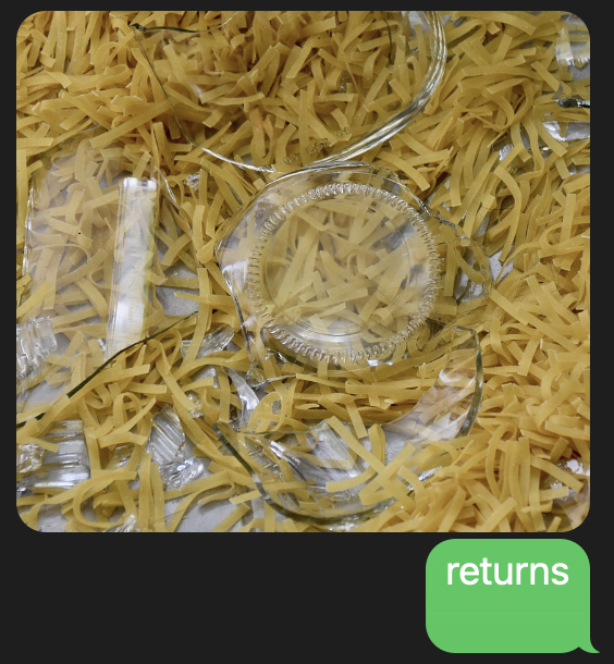 Picture of a broken glass container and spilled pasta
