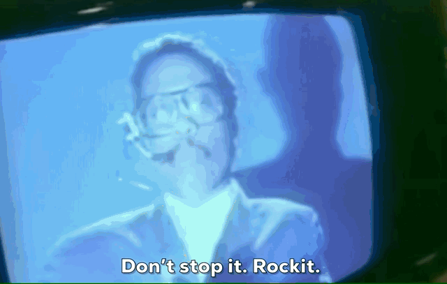 Robots dancing and Herbie Hancock singing from the music video for the song Rockit.