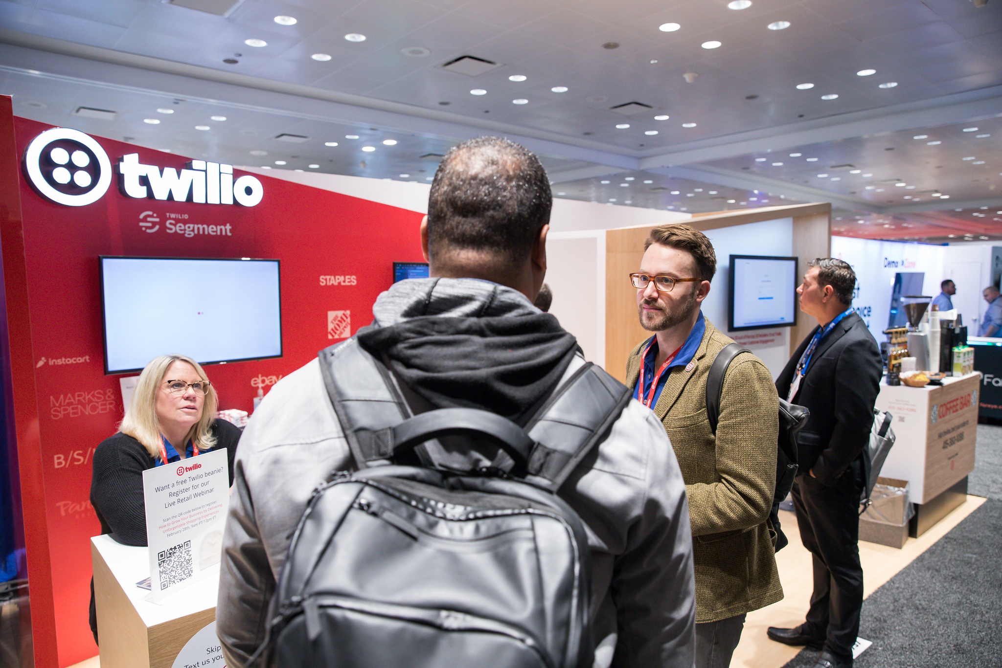 People looking at the Twilio booth at NRF 2023