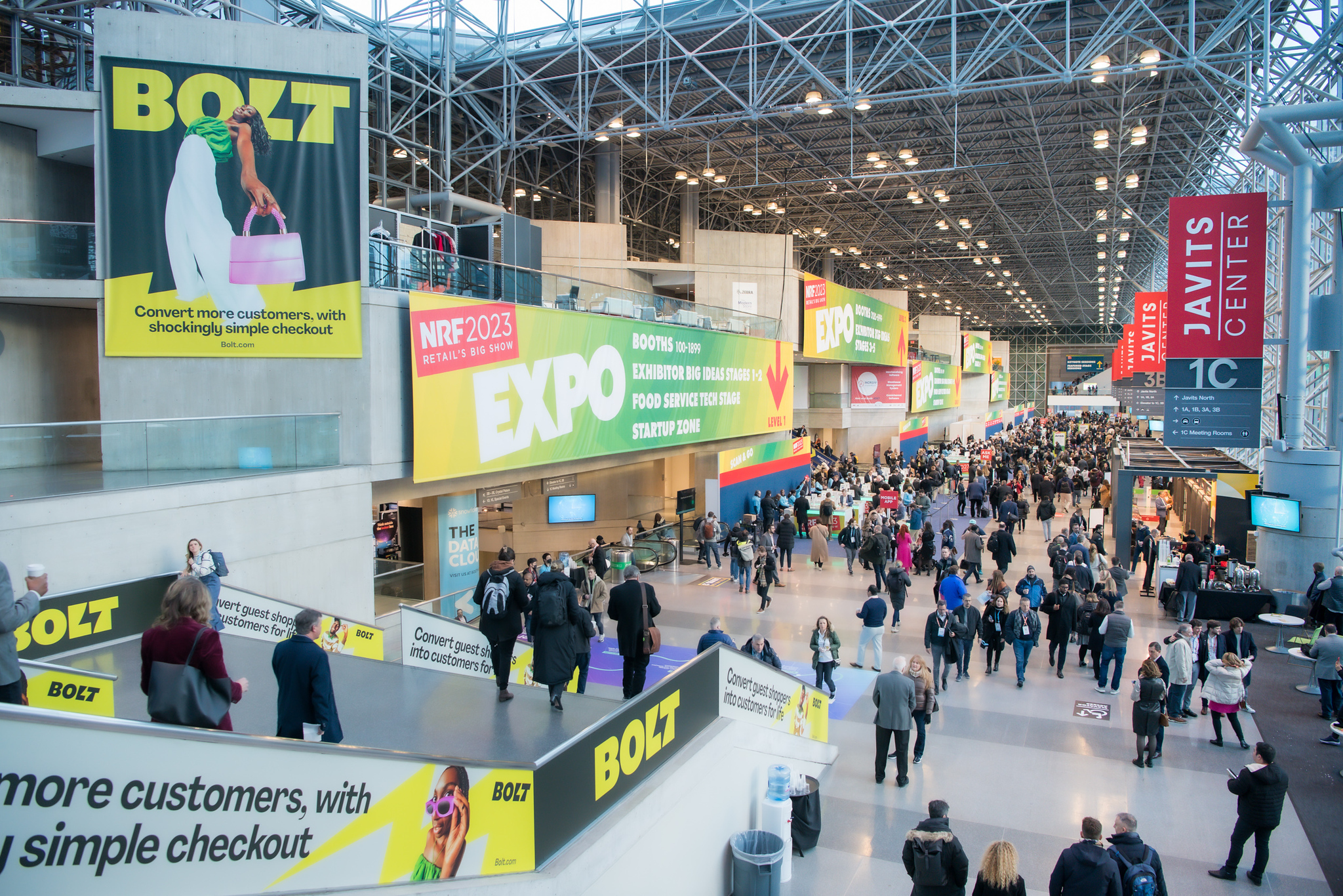 Crowds wandering through the vast halls at the conference NRF 2023.