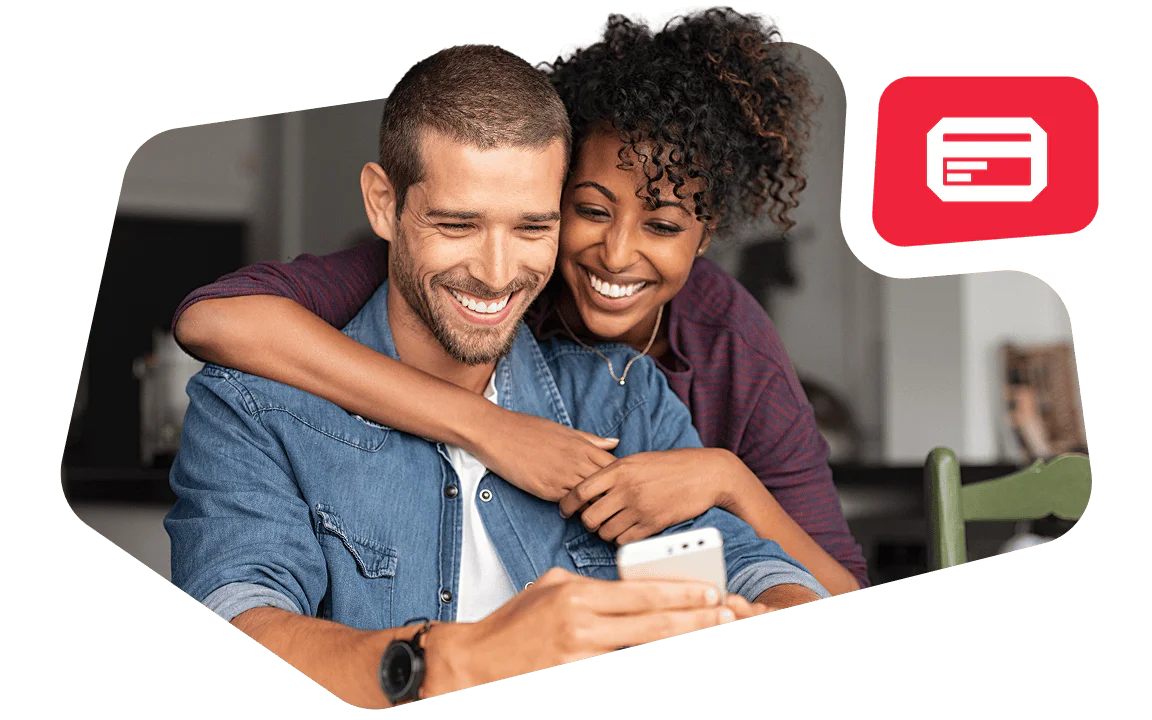 Smiling couple looking at a phone with a red card icon in the background.