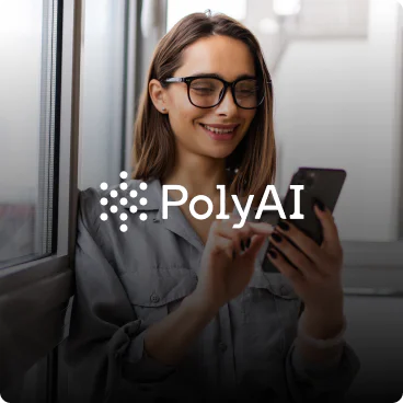 Woman Using Smartphone Beside Window with PolyAI Logo PolyAI