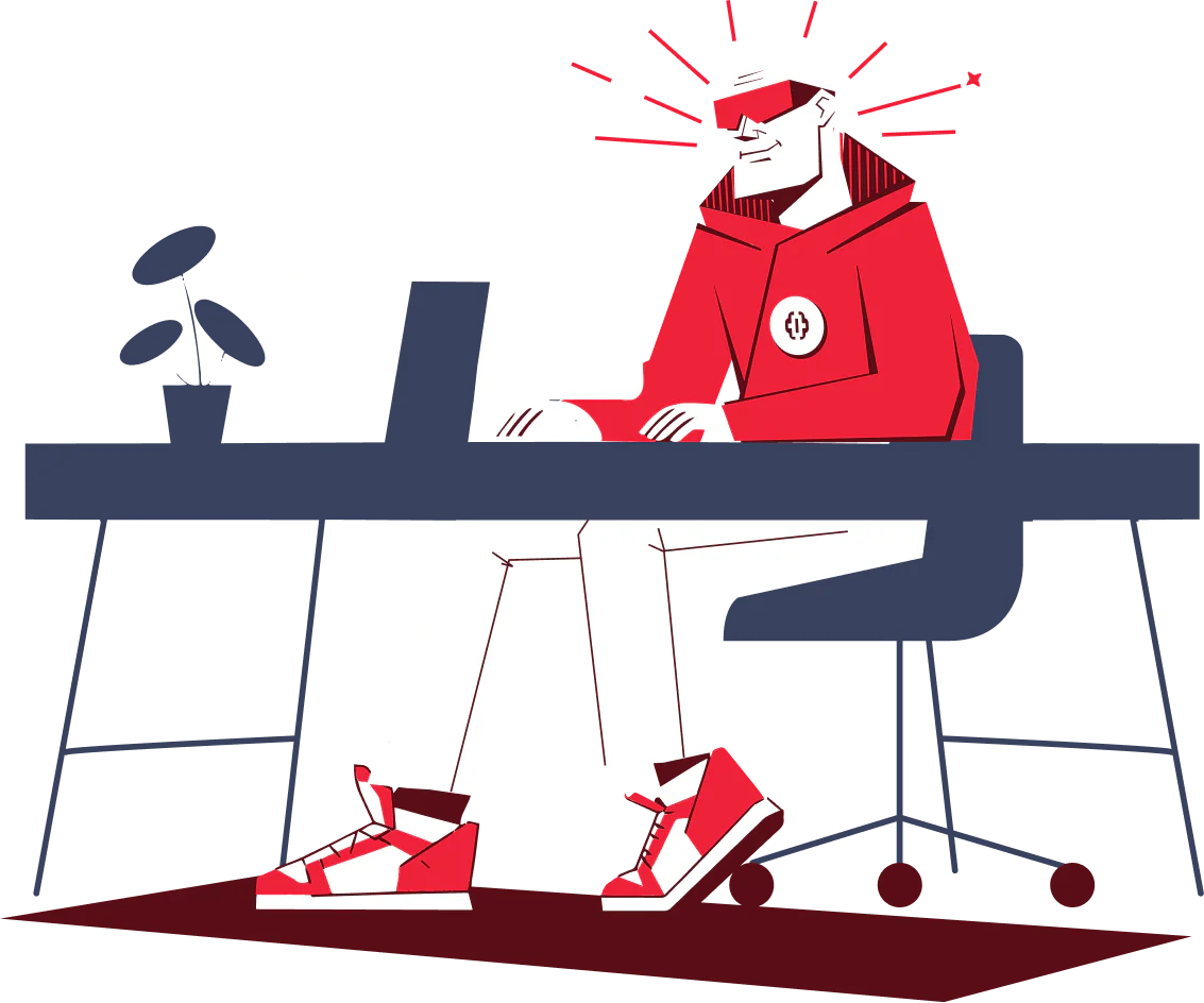 Individual seated at a desk wearing a red hoodie and VR goggles, typing on a computer.
