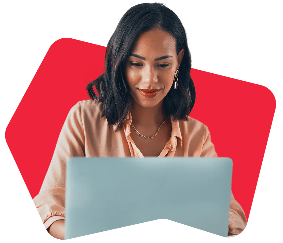 Woman with short dark hair using a laptop and smiling