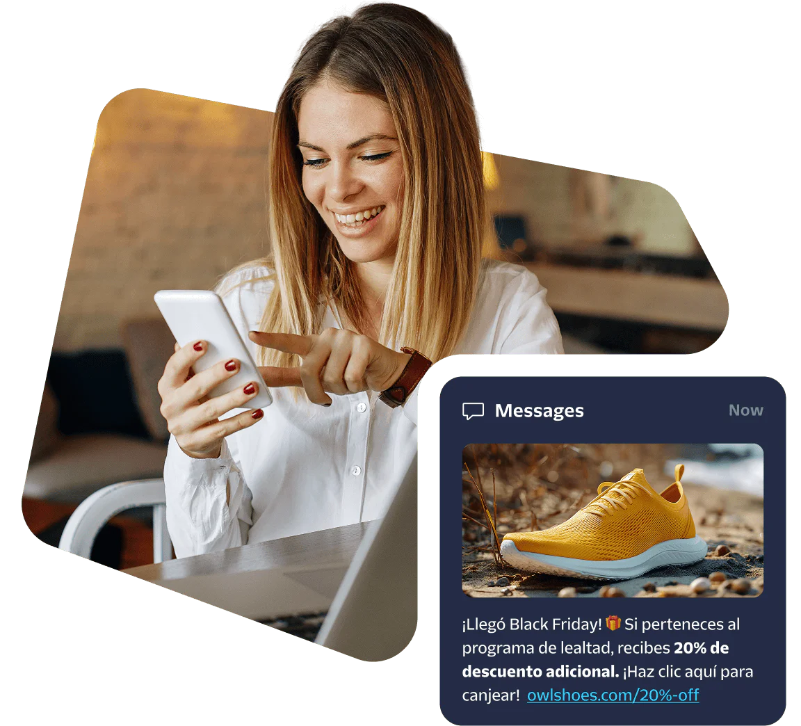 Woman using a smartphone with a laptop, viewing a Black Friday sale message featuring yellow sneakers.