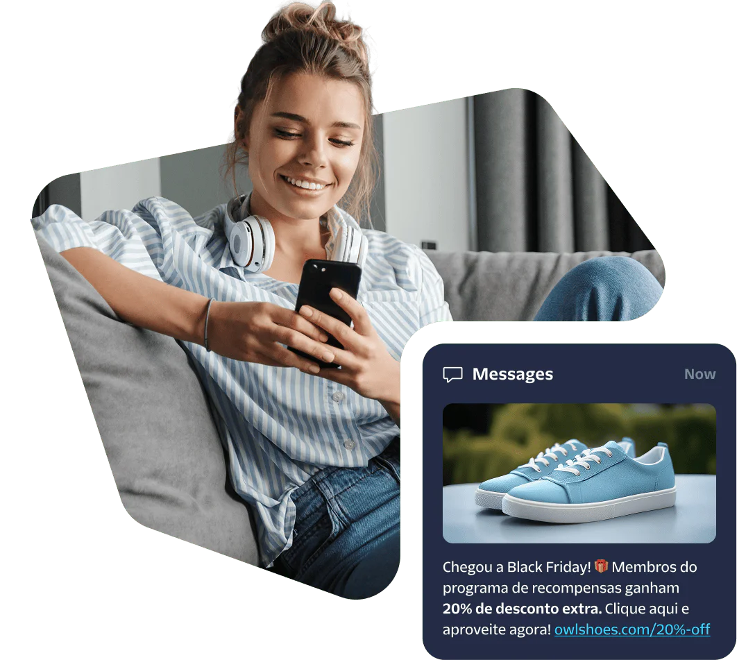 Woman smiles at phone while sitting, reading a message about a shoe discount.