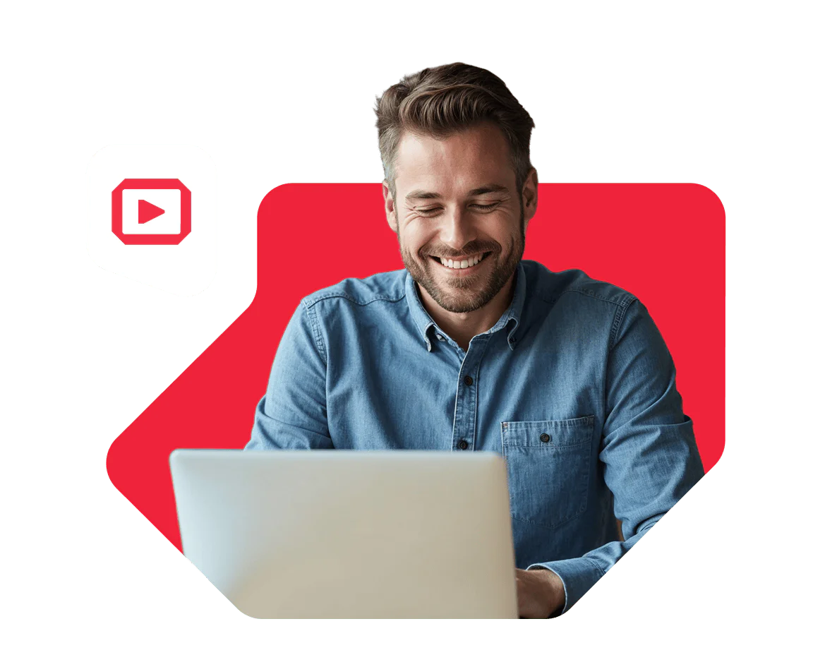 Smiling man using a laptop with virtual meeting icons around him on a red background