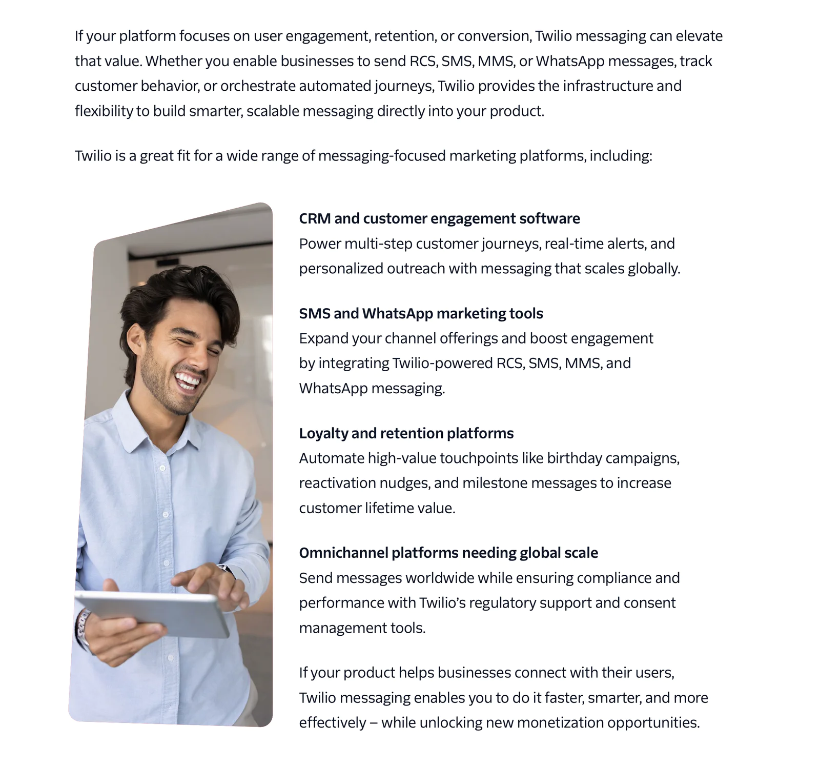 Man holding a tablet next to text about Twilio's messaging solutions for business engagement and retention.