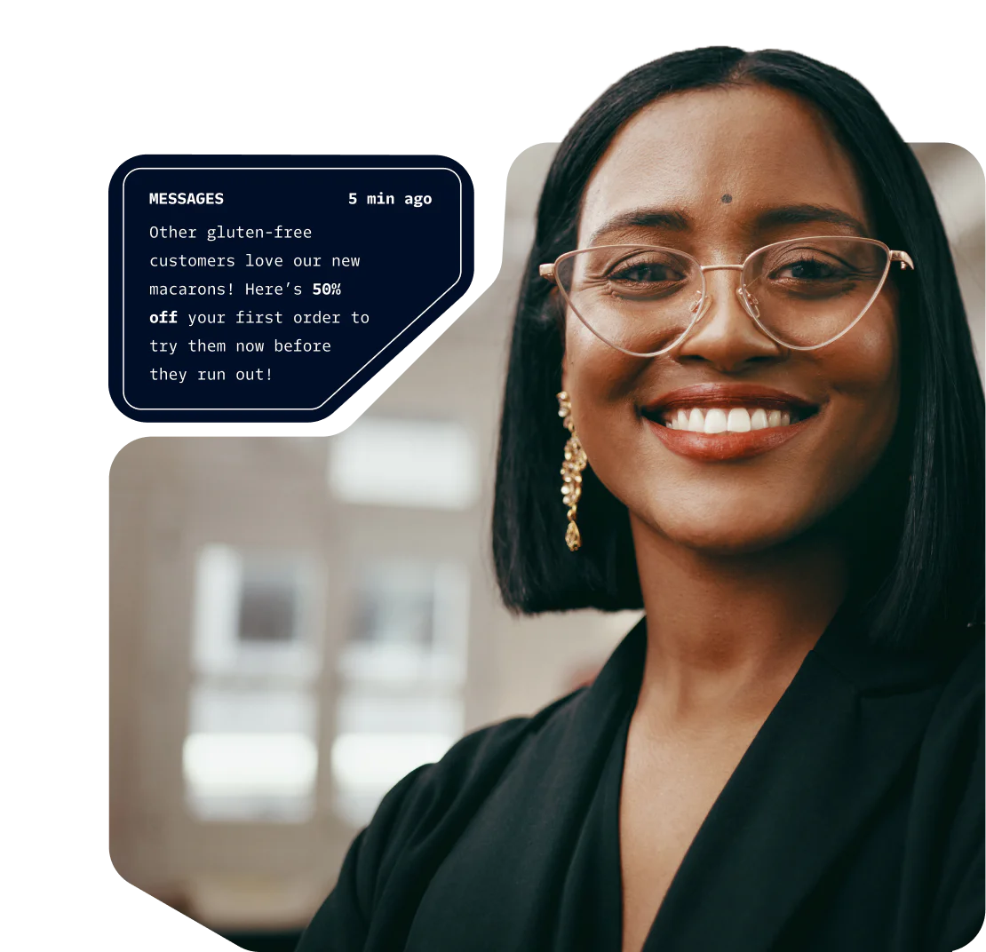 Smiling woman in glasses with promotional message about gluten-free macarons offering 50% discount.