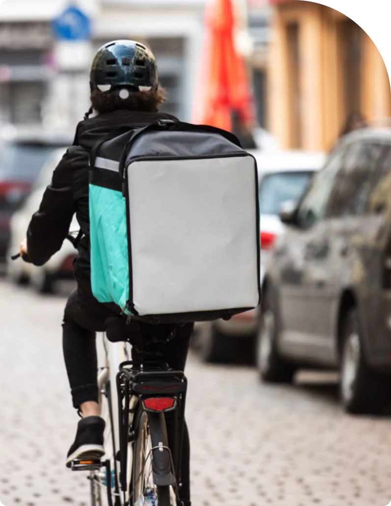 A courier makes a food delivery.