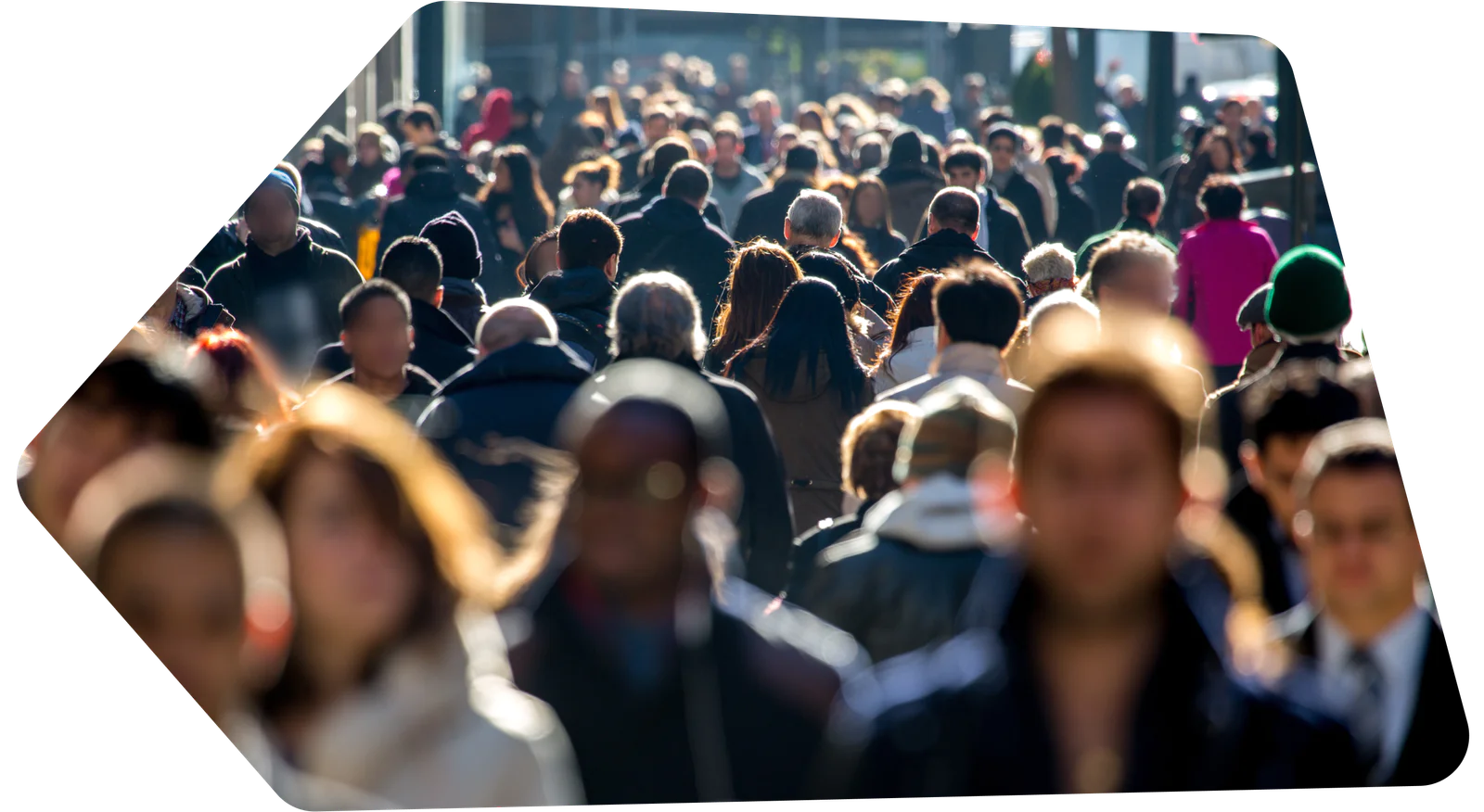 Building the future of personalization with AI Crowded city sidewalk filled with people walking in various directions.