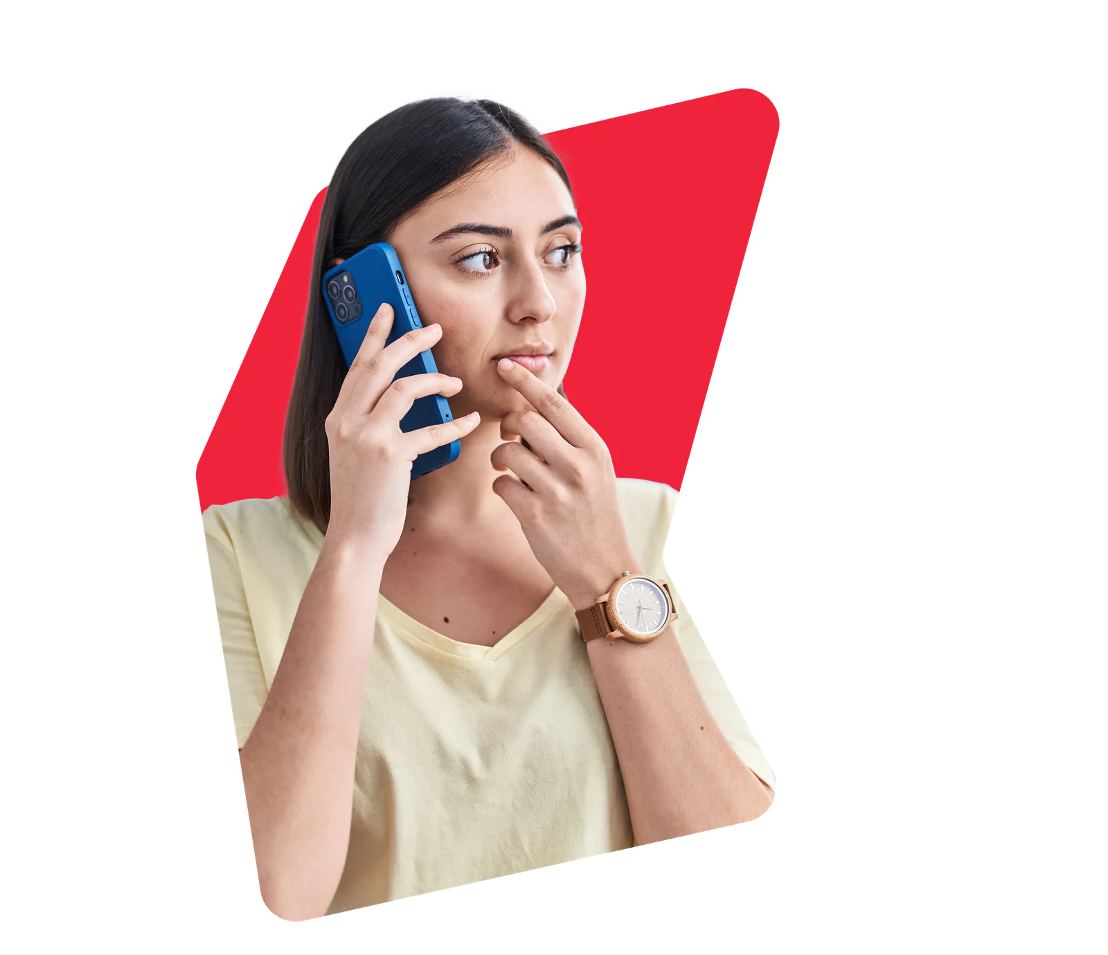 Woman holding a phone to her ear, looking thoughtful with finger on her lips, wearing a yellow shirt and a watch.