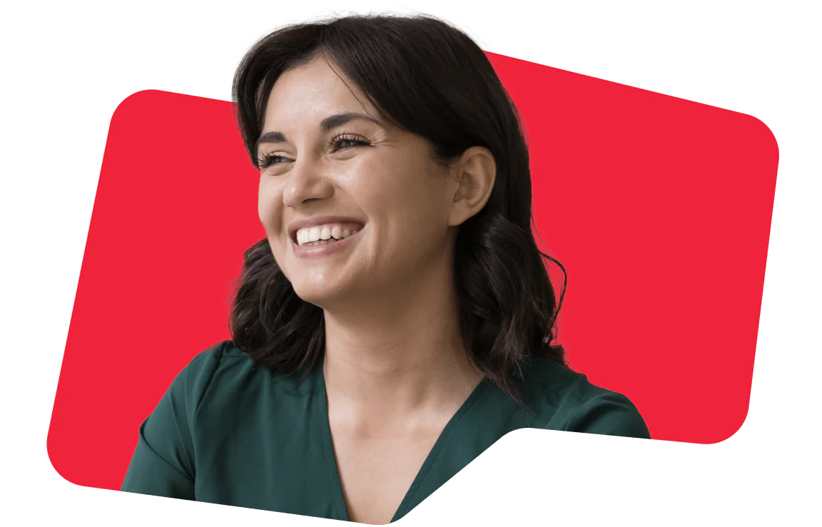 A woman smiles warmly, conveying positivity and happiness, set against a vibrant red background.