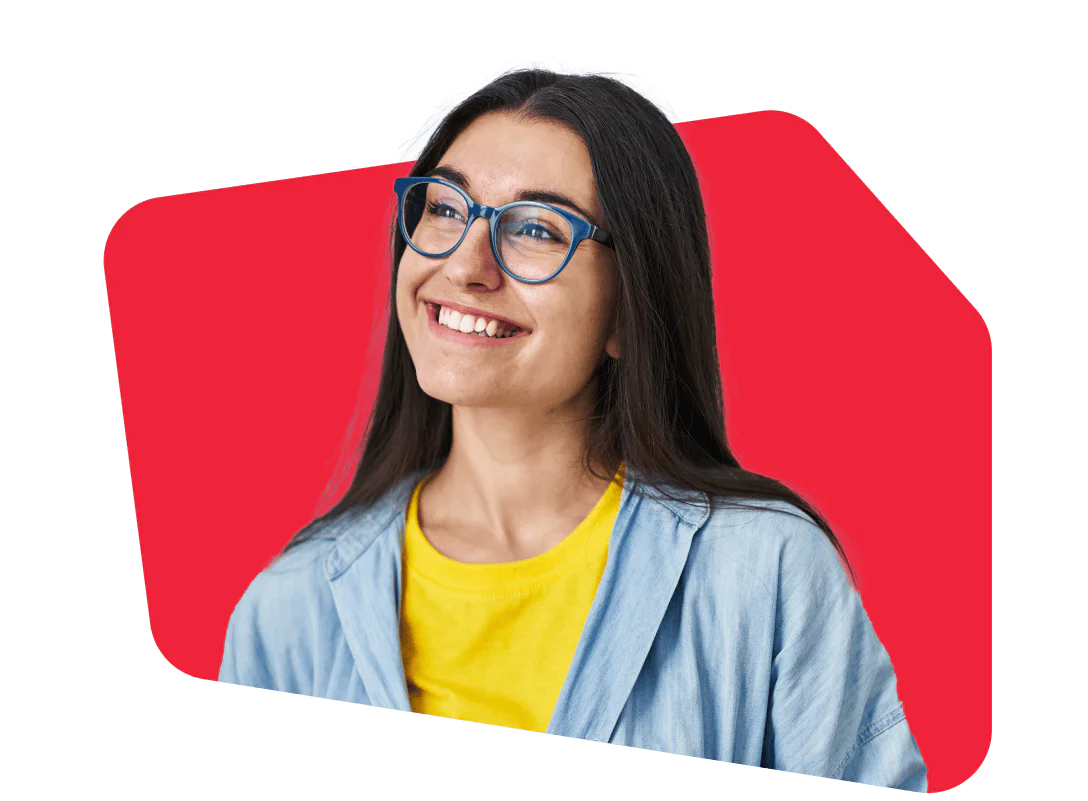 Smiling Woman with Glasses and Bright Background Woman smiling, wearing blue glasses and a yellow shirt, with a bright red background.