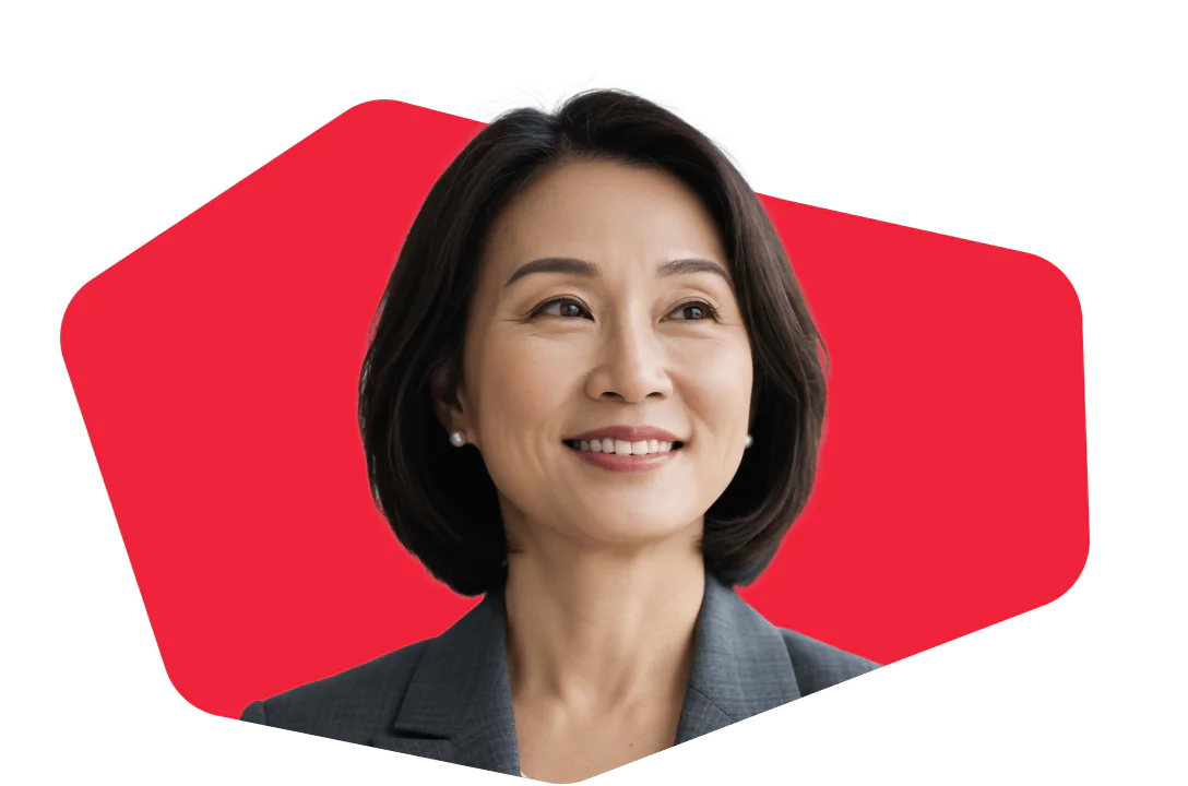 Portrait of a Confident Businesswoman with Red Background Asian woman in a business suit smiling in front of a red geometric background