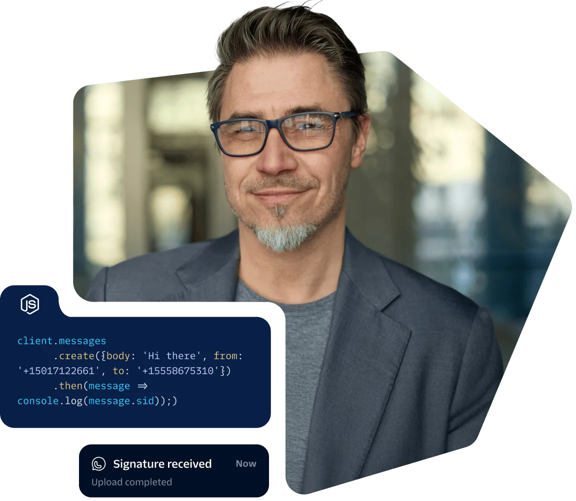 Man in glasses and blazer with programming code overlay and a notification saying Upload completed.