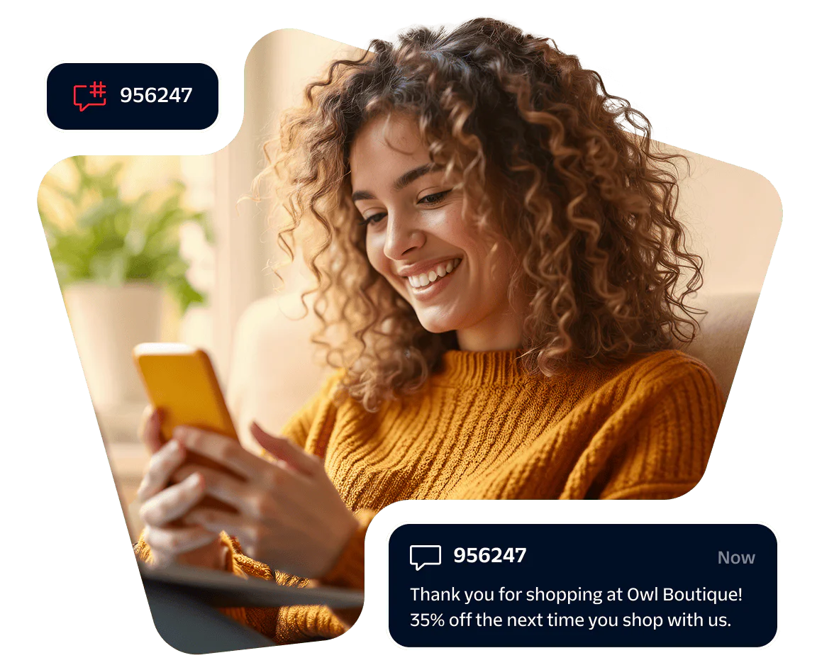 Smiling woman looking at smartphone with discount notification popup on screen.