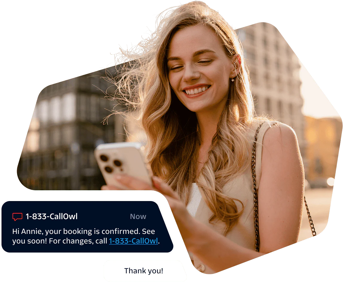 Smiling woman looking at her phone with a booking confirmation message displayed.