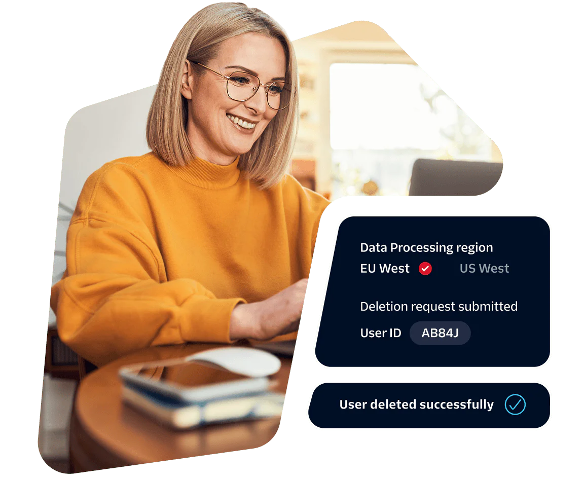 Woman in yellow sweater at laptop reviewing data processing request with status displayed.