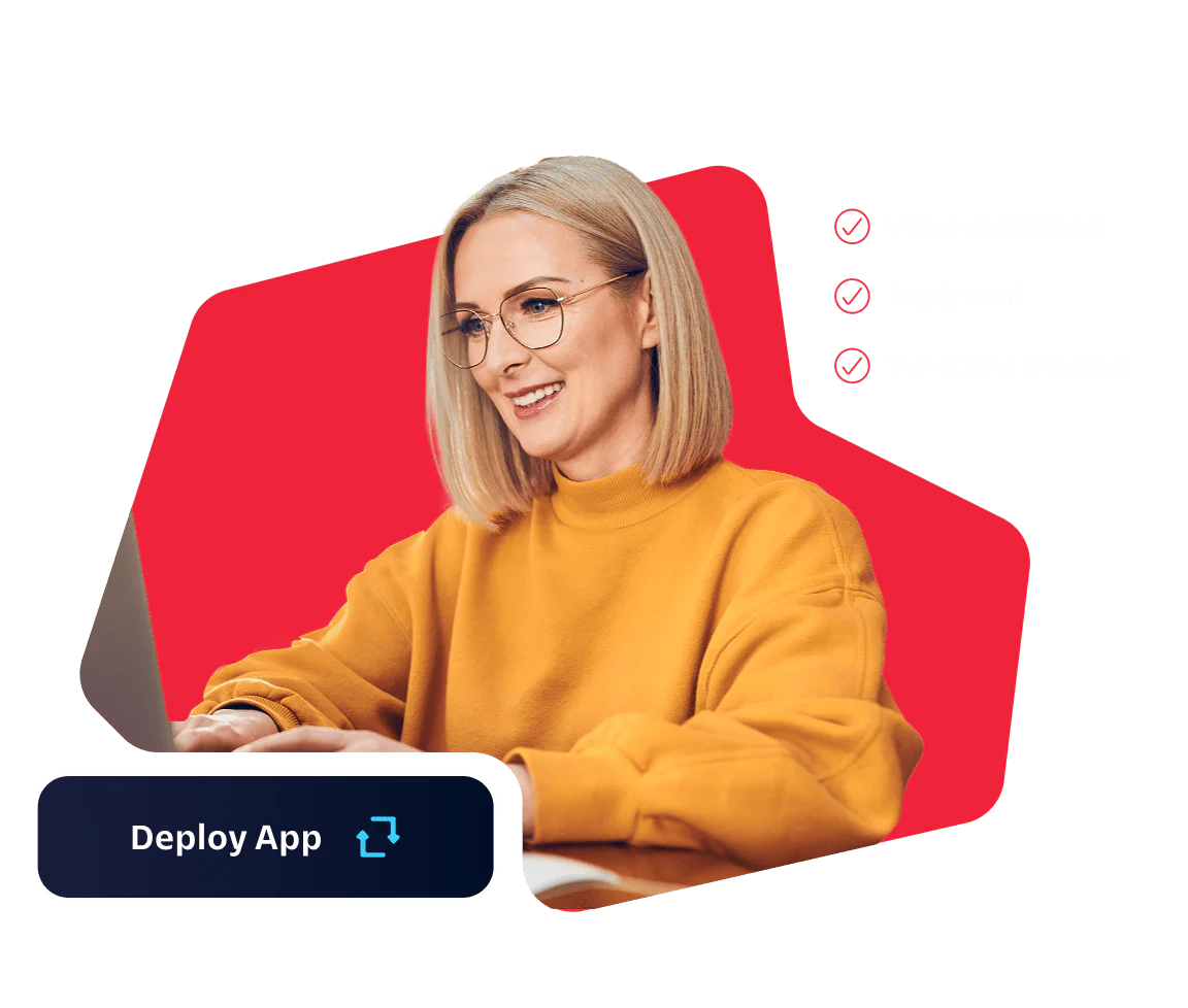 Woman in yellow sweater using a laptop with a Deploy App button and confirmed deployment status