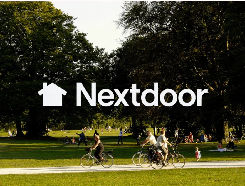 People riding bikes and relaxing in a park with Nextdoor logo overlay.