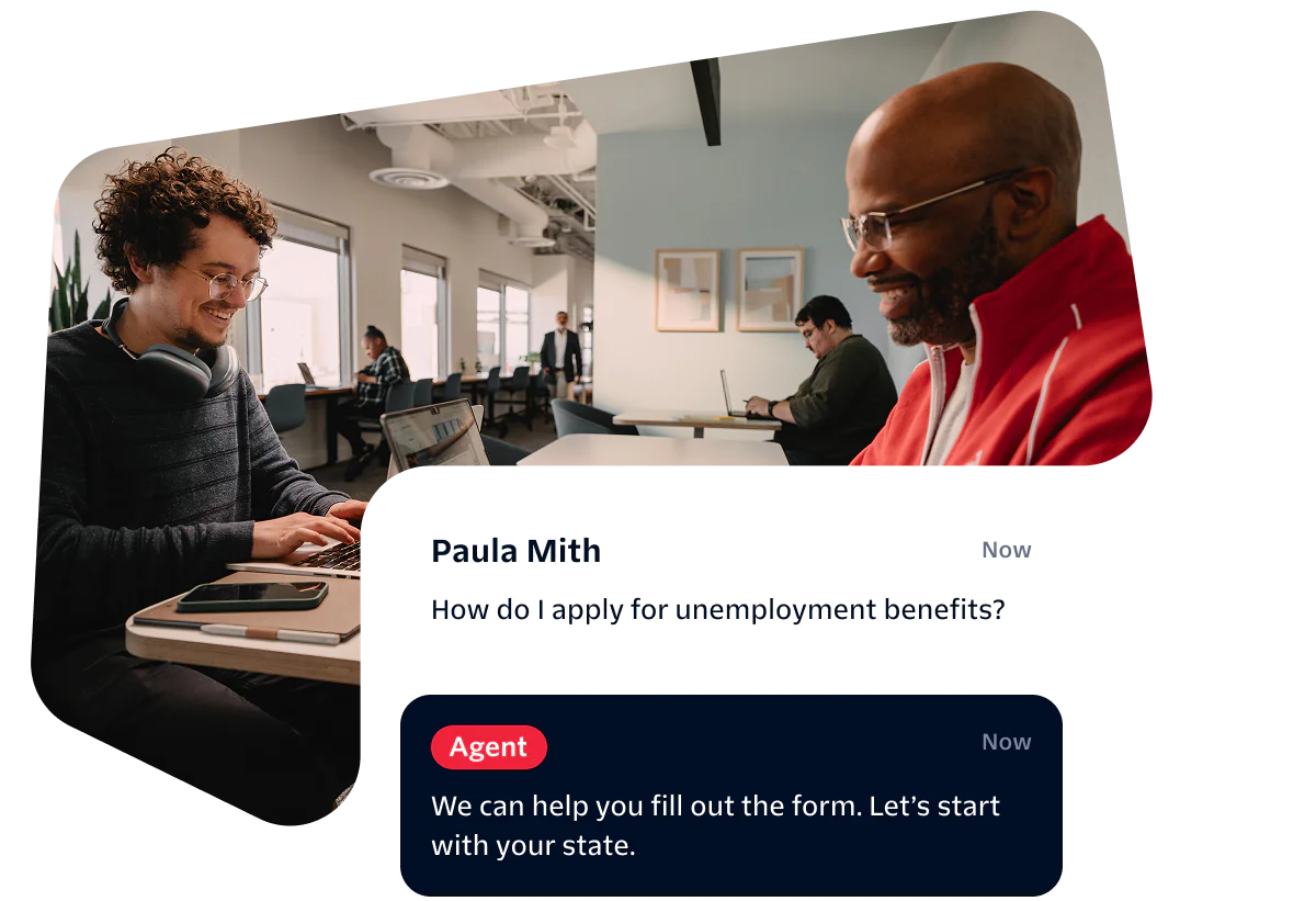 Two people working in an office, with a conversation about unemployment benefits on the screen.