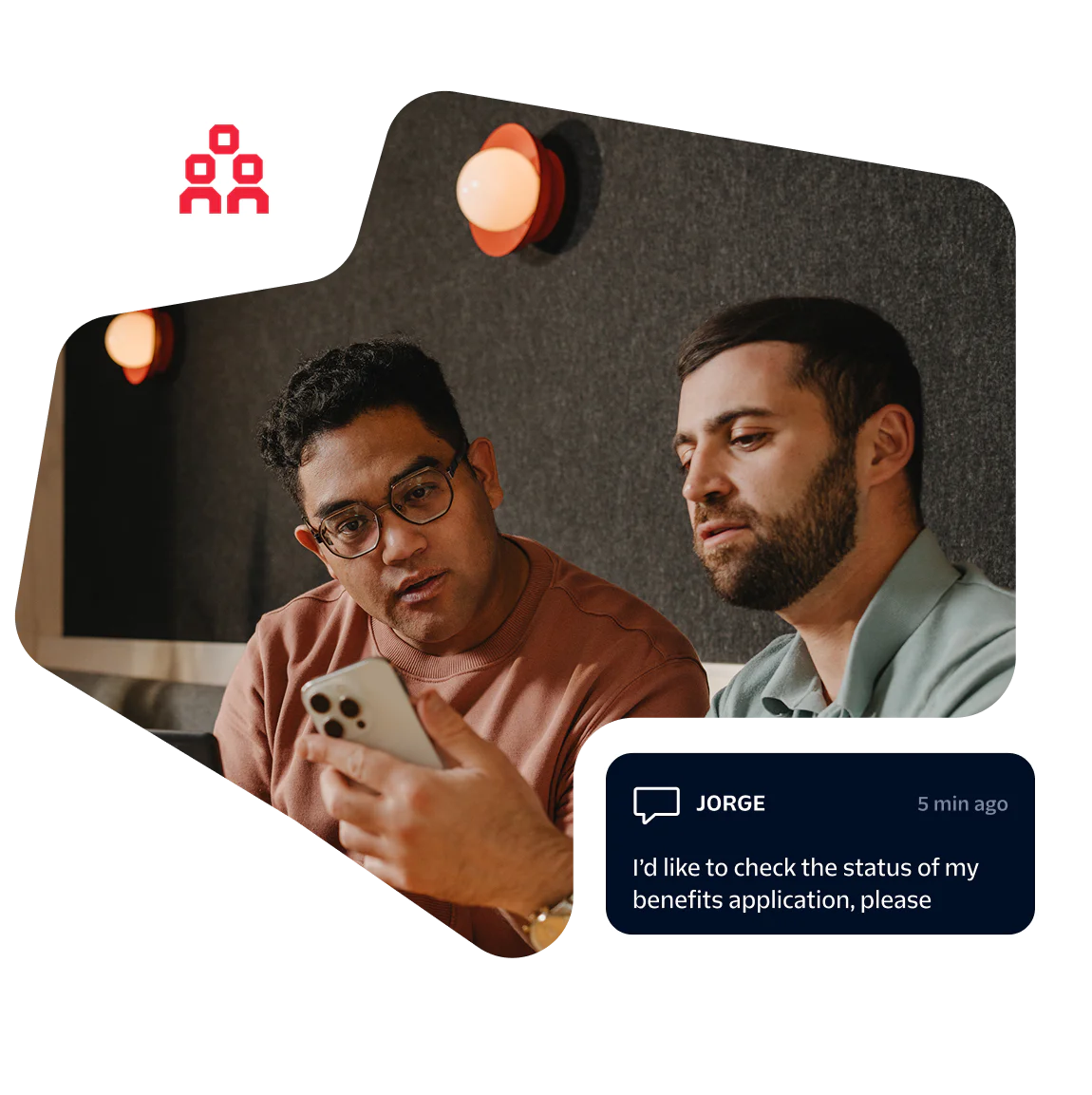 Two men looking at a phone screen with a benefits application message displayed