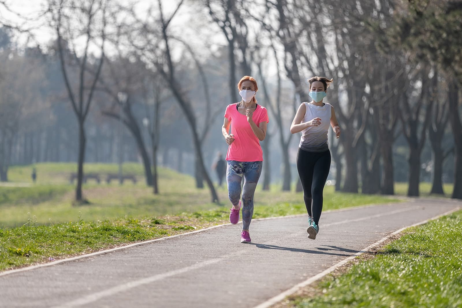 Joggers wearing masks