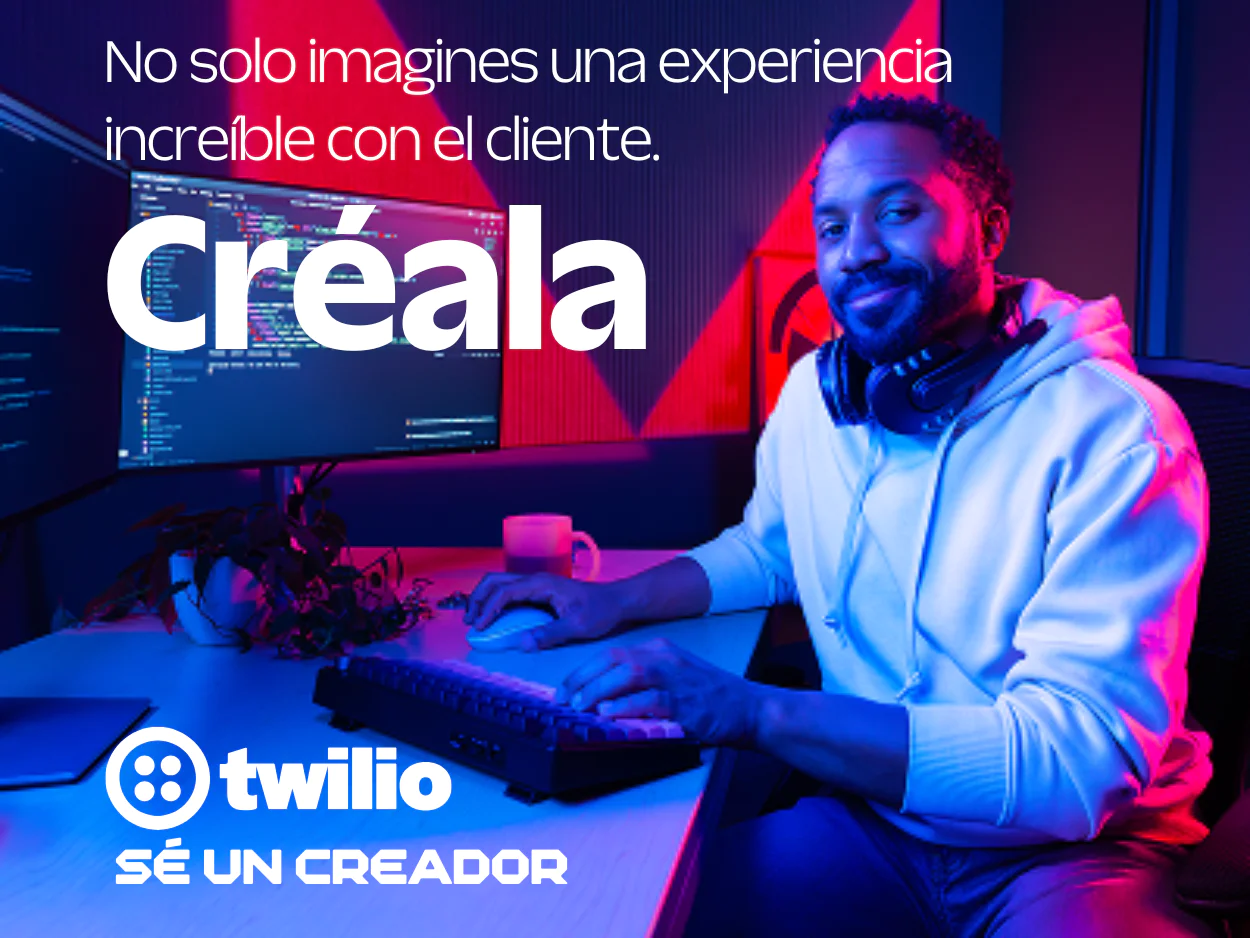 Developer Desk with Twilio Advertisement A content creator in a hoodie sits at a desk with dual monitors and Twilio branding.