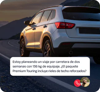 SUV on winding road at dusk with a woman's chat bubble asking about reinforced roof rails.