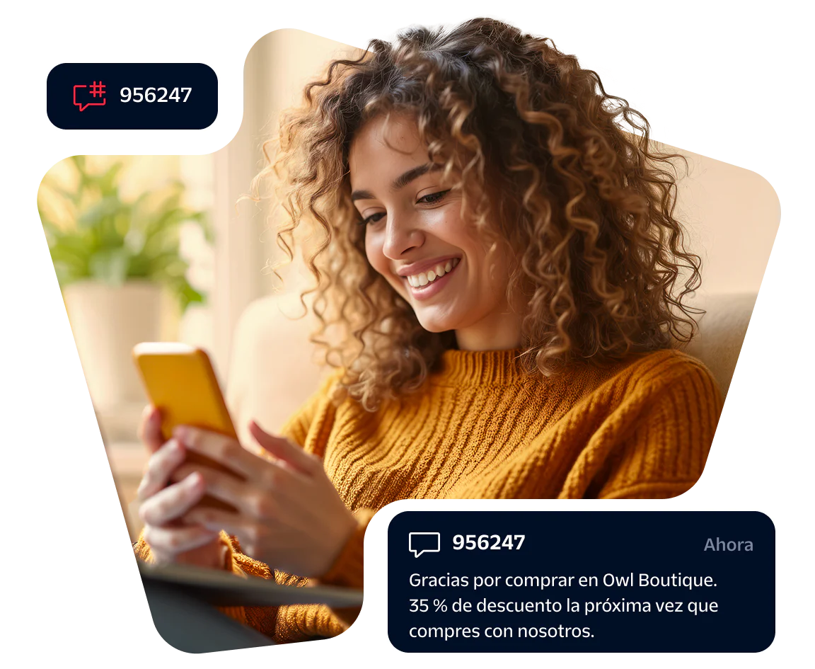 Smiling woman looking at smartphone with discount notification popup on screen.