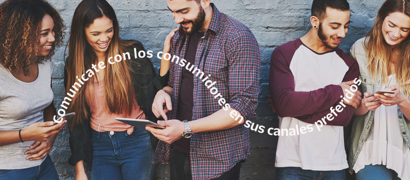 Diverse group of friends looking at mobile devices and tablet, text above says Meet consumers on their preferred channels.