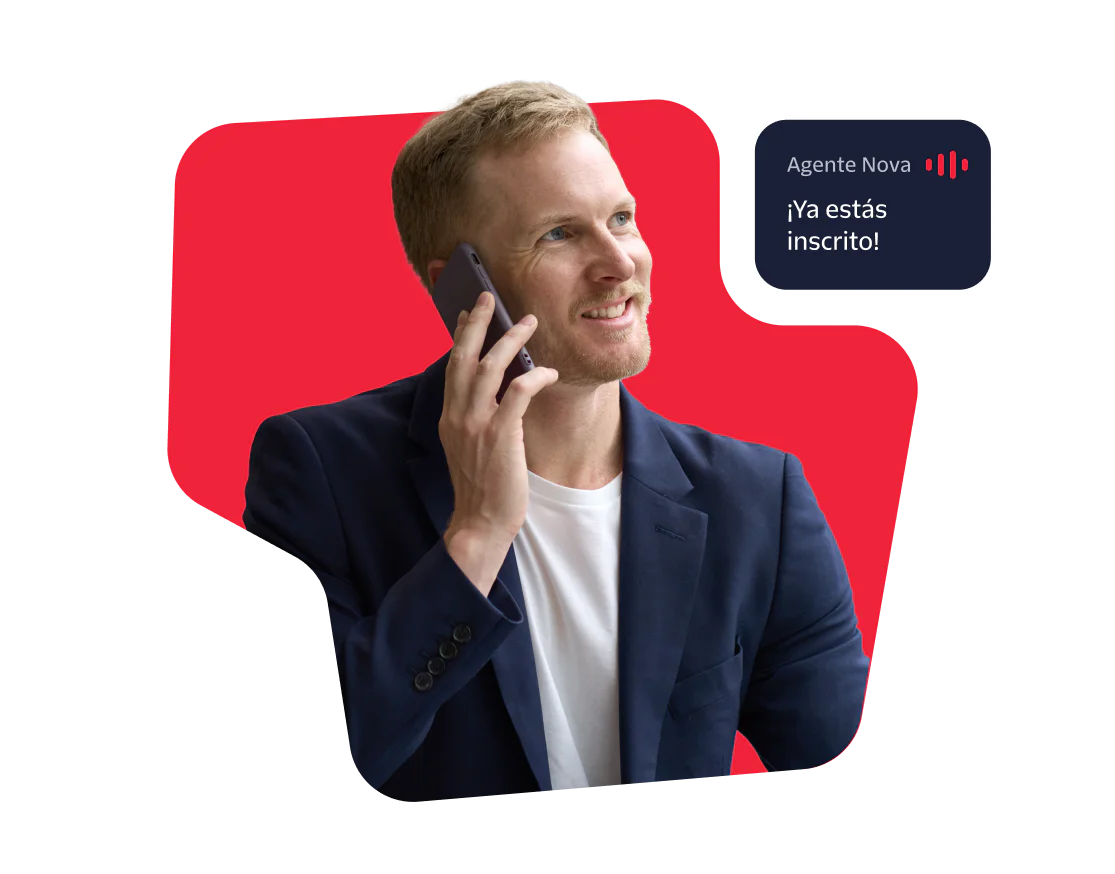 Man Talking on the Phone with Booking Confirmation Smiling man in a blue blazer on a phone call with a booking confirmation message.