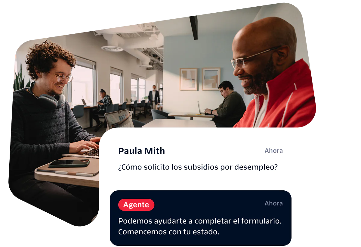 Two people working in an office, with a conversation about unemployment benefits on the screen.