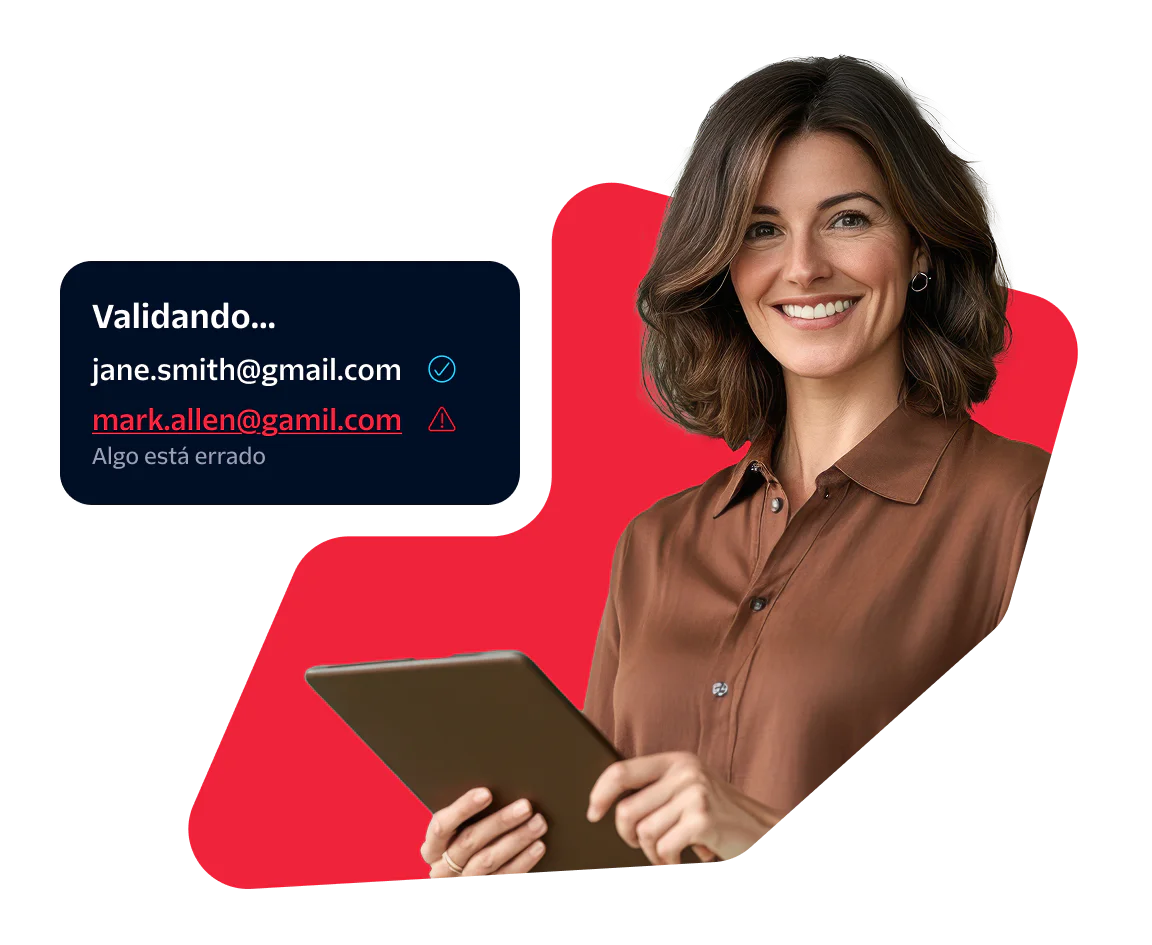 Woman using a tablet while validating email addresses Woman holding a tablet with a screen showing email validation results