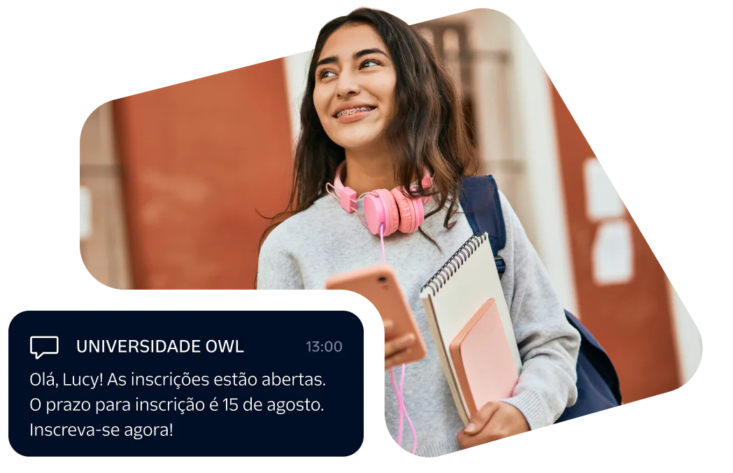 Smiling student with pink headphones, holding books and phone, receiving registration message from university.