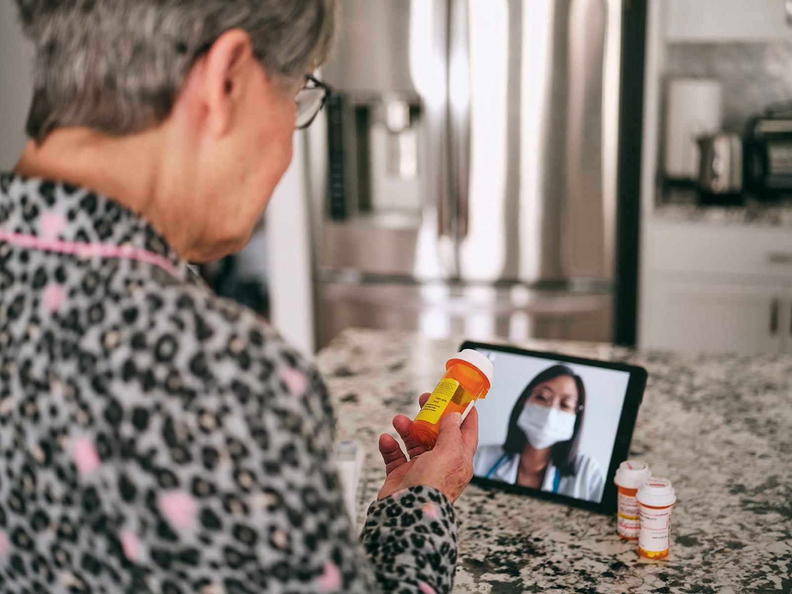 Patient chatting with her doctor via telehealth video