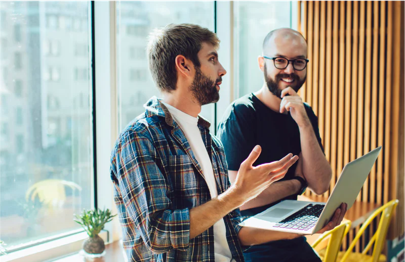 Two colleagues debugging software