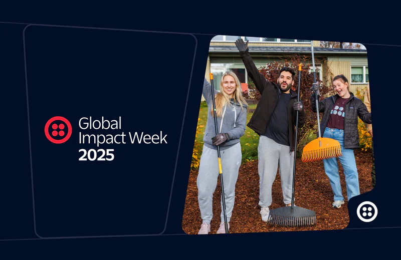 Three volunteers with rakes, smiling and posing during Global Impact Week 2025.